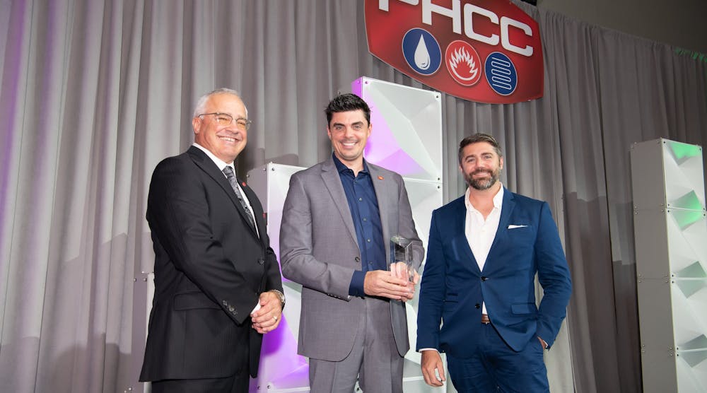 From left to right, presenter Dave Frame (2022-2023 PHCC-National President), Tony Bertolino (holding the award) and Rob Bertolino.