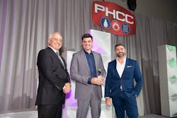 From left to right, presenter Dave Frame (2022-2023 PHCC-National President), Tony Bertolino (holding the award) and Rob Bertolino. From left to right, presenter Dave Frame (2022-2023 PHCC-National President), Tony Bertolino (holding the award) and Rob Bertolino.
