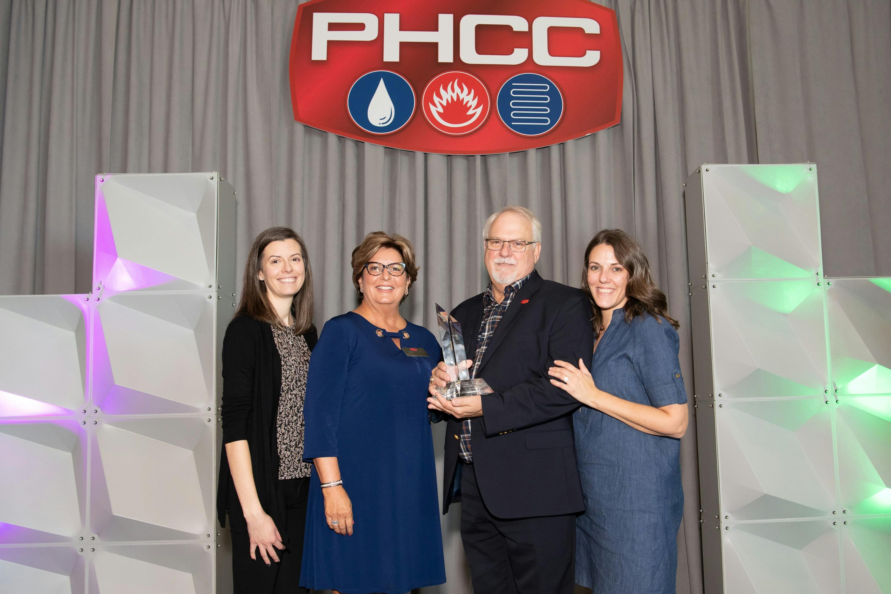 Kevin Tindall accepts the George D. Scott Award at PHCCCONNECT2023.