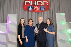 Kevin Tindall accepts the George D. Scott Award at PHCCCONNECT2023. Kevin Tindall accepts the George D. Scott Award at PHCCCONNECT2023.