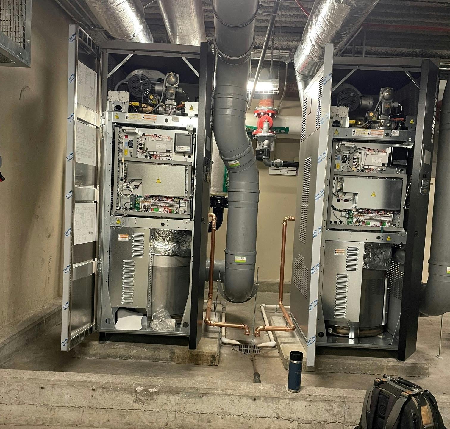 The original boilers at luxury condo building 100 Pier 4 in Boston needed to be replaced because of failing heat exchangers. The E.M. Duggan crew installed two Laars MagnaTherm boilers because of the company&rsquo;s heat exchanger reputation.