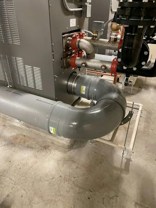 The Duggan crew removed the old flue and installed a new flue using Centrotherm polypropylene flue piping to meet code. John Lamb, account manager at Duggan Mechanical Services, notes that the plastic piping has fewer leaks than stainless steel.