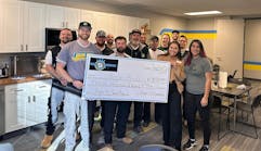 The High 5 Plumbing team donates a check for $3,000 to Hope House of Colorado.