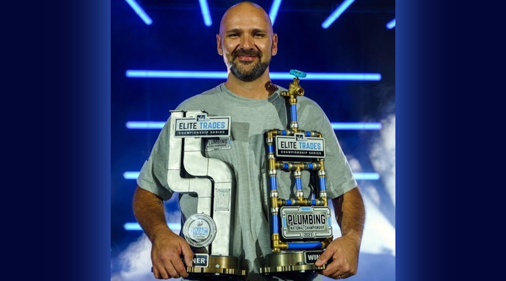 Graig Childress holds his two first place trophies.