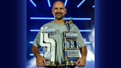 Graig Childress holds his two first place trophies. Graig Childress holds his two first place trophies.