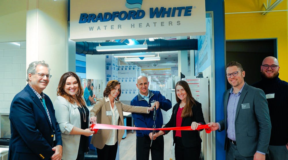 Bill Coderre, president and CEO of Junior Achievement of the MI Great Lakes (far left), joins with Bradford White representatives, Tonya Westrate, Peter Kattula and Rebecca Owens, and others to cut the ribbon at Bradford White&rsquo;s storefront space at JA Finance Park.