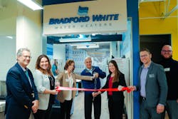 Bill Coderre, president and CEO of Junior Achievement of the MI Great Lakes (far left), joins with Bradford White representatives, Tonya Westrate, Peter Kattula and Rebecca Owens, and others to cut the ribbon at Bradford White’s storefront space at JA Finance Park. Bill Coderre, president and CEO of Junior Achievement of the MI Great Lakes (far left), joins with Bradford White representatives, Tonya Westrate, Peter Kattula and Rebecca Owens, and others to cut the ribbon at Bradford White’s storefront space at JA Finance Park.