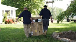 Transporting the ProLine® XE Tankless Condensing Gas Water Heater to the mechanical room. Transporting the ProLine® XE Tankless Condensing Gas Water Heater to the mechanical room.