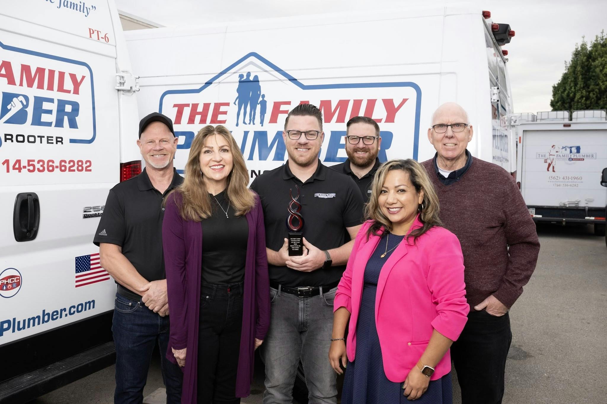 Mike Prencavage Jr. proudly displays the 2023 Contractor of the Year Award for the PHCC Orange County, Riverside and San Bernadino. From l to r: Mike Prencavage Sr.; Vicky Prencavage; Mike Prencavage Jr.; Mitch Prencavage; Monica Roach, PHCC Orange County Executive Director; and Doug Allen, PHCC Orange County Educational Director.