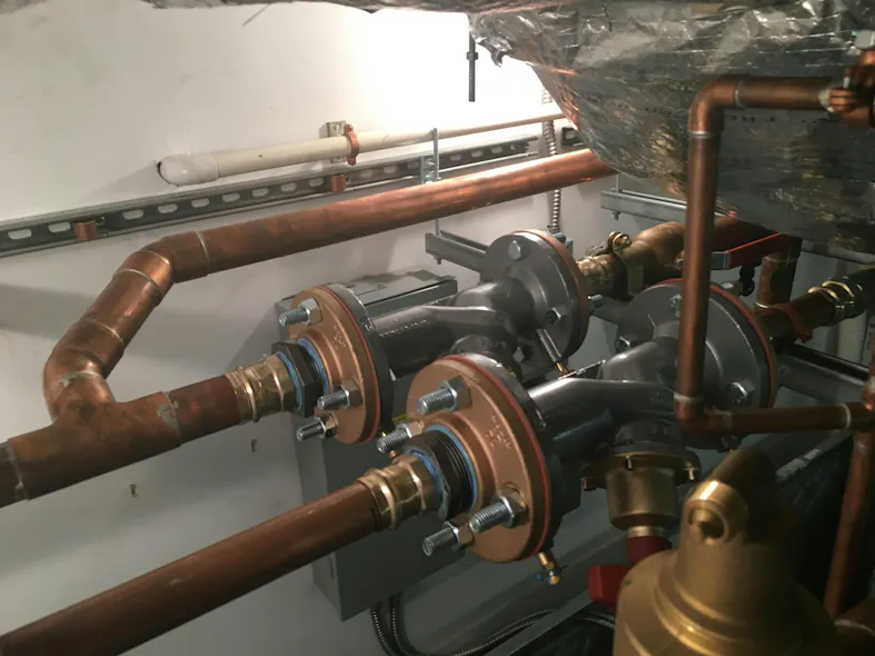 Main home mechanical room with balancing valves, fluid cooler loop and main home loop. Main home mechanical room with balancing valves, fluid cooler loop and main home loop.