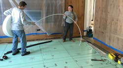 NMD technicians install Uponor PEX tubing into Warmboard panels. NMD technicians install Uponor PEX tubing into Warmboard panels.