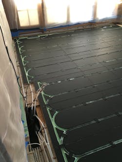 PEX tubing and Warmboard painted flat black to increase radiant heat transfer to the floating floor. PEX tubing and Warmboard painted flat black to increase radiant heat transfer to the floating floor.