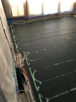 PEX tubing and Warmboard painted flat black to increase radiant heat transfer to the floating floor. PEX tubing and Warmboard painted flat black to increase radiant heat transfer to the floating floor.
