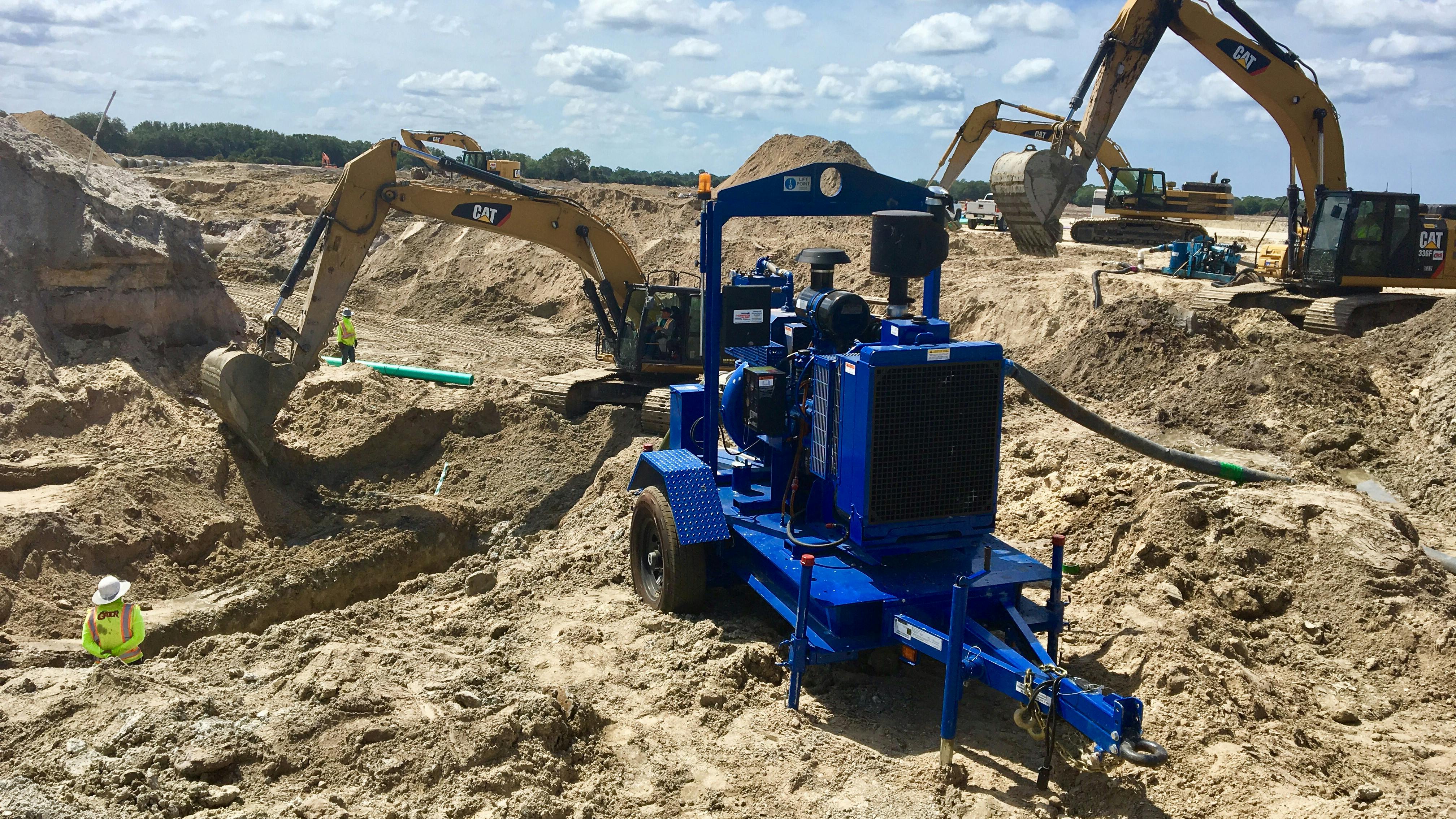 Cat machines on the job site.