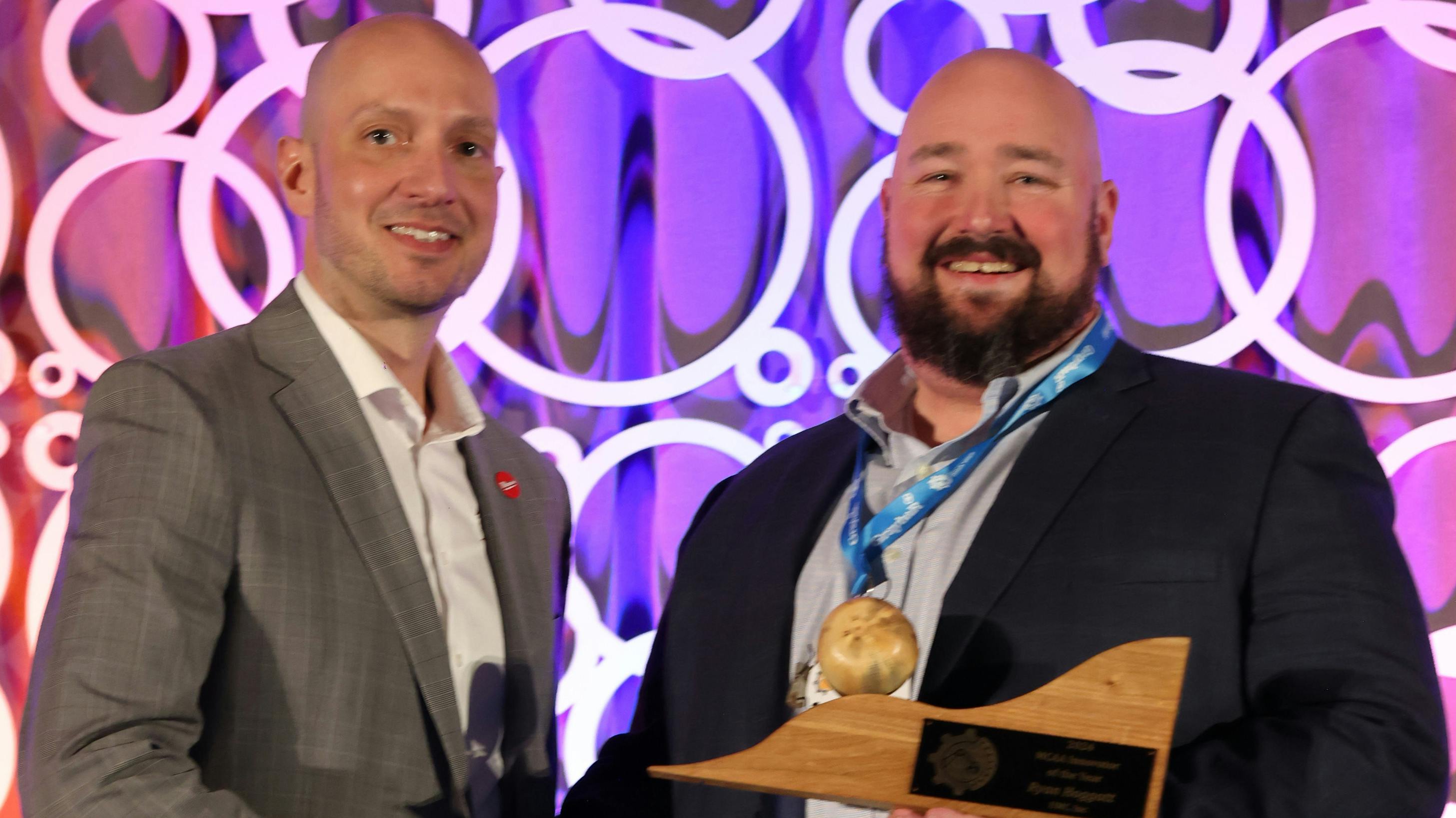 Ryan Hoggatt (right) accepting the 2024 MEP Innovator of the Year award.
