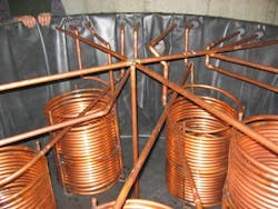 The solar storage tank holds copper heat exchangers for the pool, radiant heating system and domestic hot water heating. The solar storage tank holds copper heat exchangers for the pool, radiant heating system and domestic hot water heating.