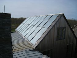 Twenty solar hot water collectors can slide laterally up to one inch. Twenty solar hot water collectors can slide laterally up to one inch.