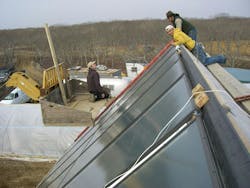 NMD Techs install hot water sensors on the solar collectors. NMD Techs install hot water sensors on the solar collectors.