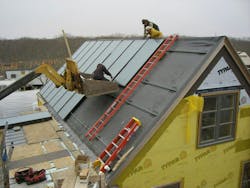 NMD techs make connections between the solar collectors. NMD techs make connections between the solar collectors.