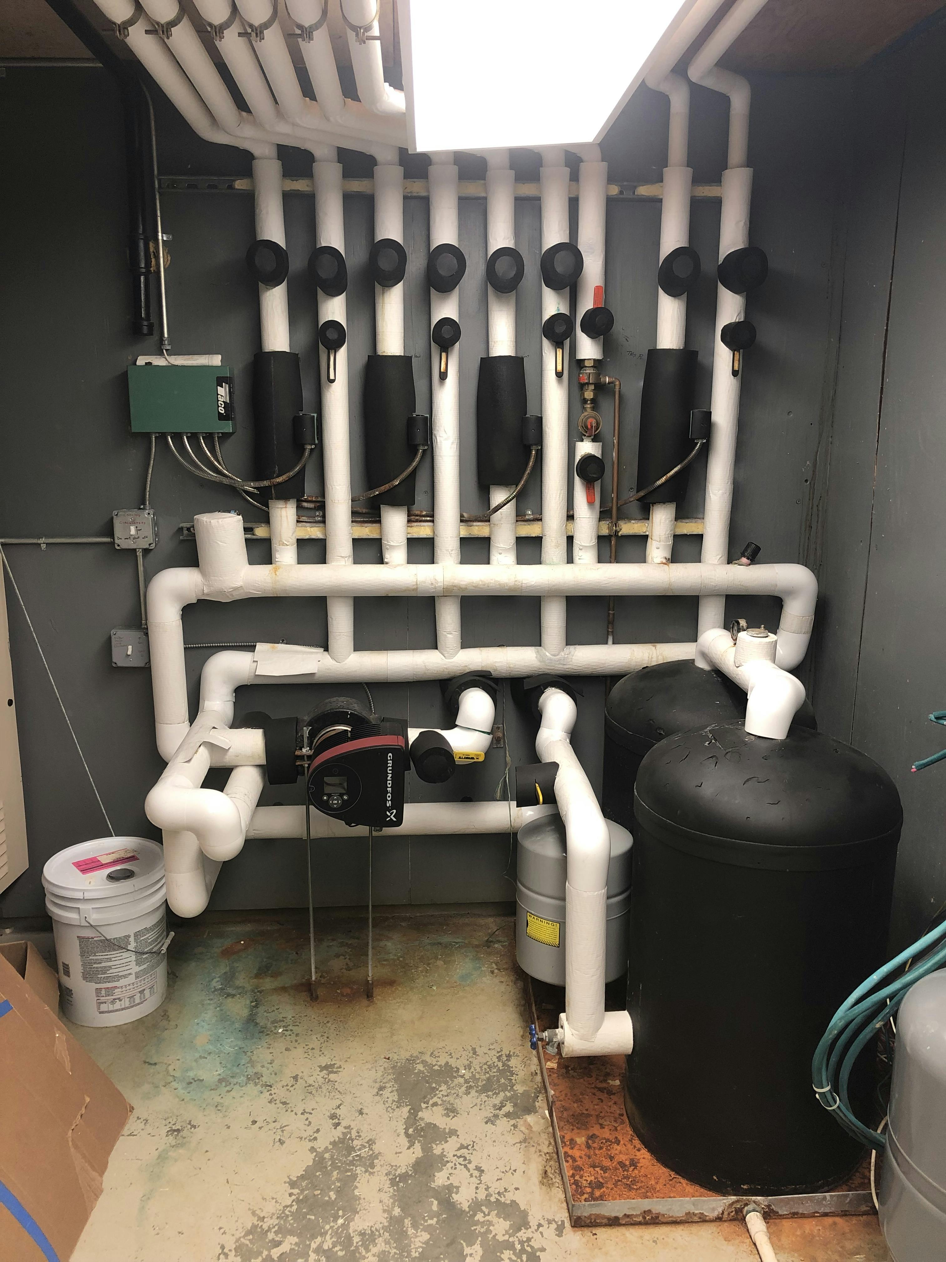 Seriously confused piping in the mechanical room along with insulation.