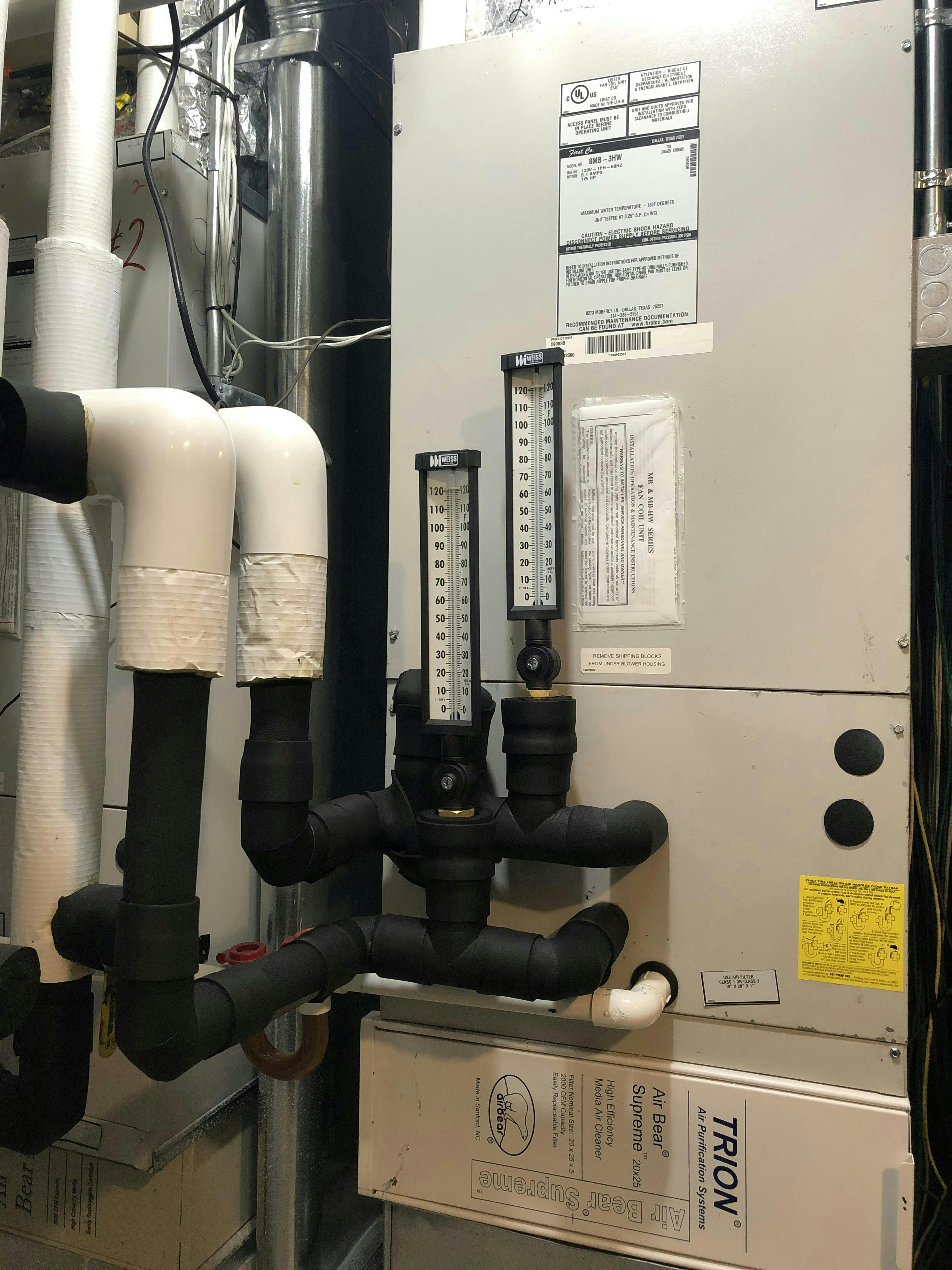 Thermometers and insulation complete the piping corrections.