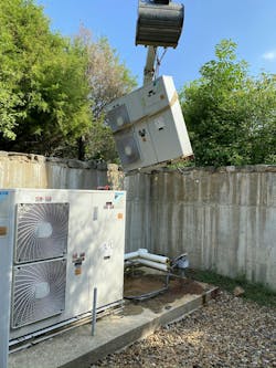 A Daikin Altherma being lifted out. A Daikin Altherma being lifted out.