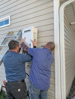 Michael Stefans of Colosetti Plumbing (left) and Danny Giosa from The Brookwood Inn (right) generously donated their labor to install a Noritz America NR66 series tankless water heater. Michael Stefans of Colosetti Plumbing (left) and Danny Giosa from The Brookwood Inn (right) generously donated their labor to install a Noritz America NR66 series tankless water heater.