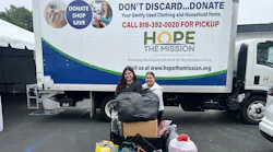 Rooter Hero employees with some of the collected clothing.