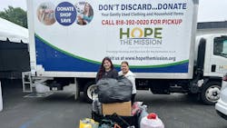 Rooter Hero employees with some of the collected clothing. Rooter Hero employees with some of the collected clothing.