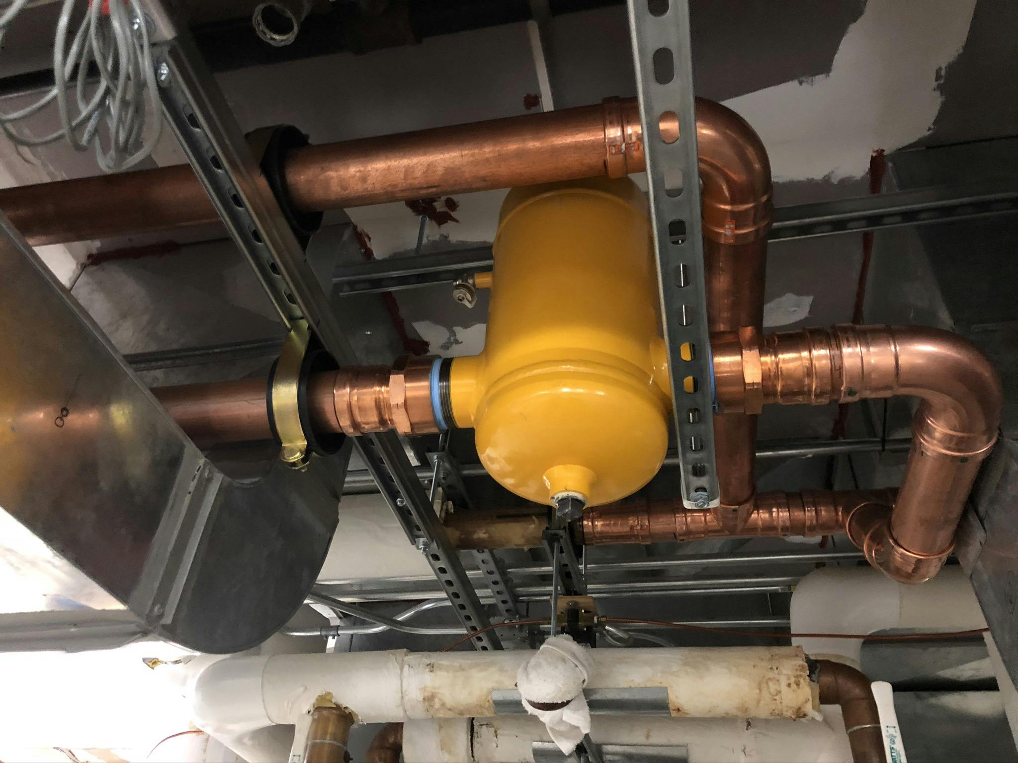 New air separator pressed in with strut cushion clamps for support and location.