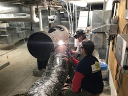 Cutting up the old boiler for removal. Cutting up the old boiler for removal.