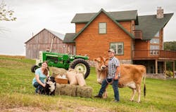 Keith and Jenessa Frey working their farm. Keith and Jenessa Frey working their farm.