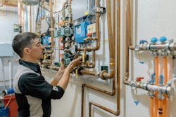 Vertex Mechanical jobsite supervisor Jared Fox sets one of many Taco ECM circulators as part of the mechanical system’s renovation. Vertex Mechanical jobsite supervisor Jared Fox sets one of many Taco ECM circulators as part of the mechanical system’s renovation.