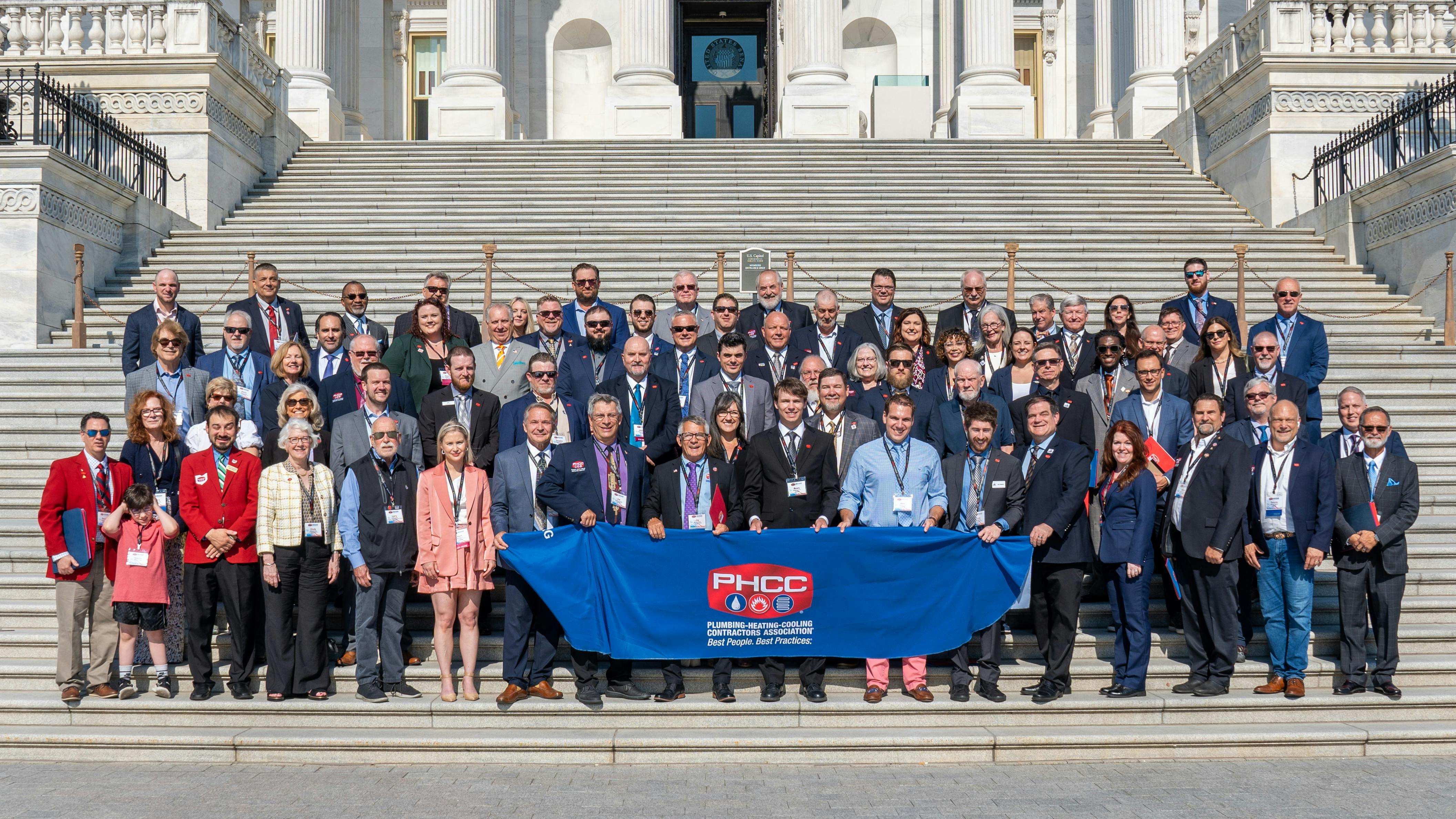 A group photo on the steps of the US Capitol Building.