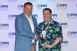 David M. Fink (left), president PPI, congratulates Dell Doyle for being named Member of the Year for the Energy Piping Systems Division of PPI. David M. Fink (left), president PPI, congratulates Dell Doyle for being named Member of the Year for the Energy Piping Systems Division of PPI.