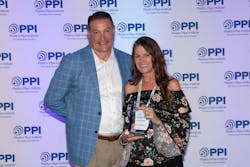 David Fink, PPI President, congratulates Jennifer Reeves of Petroflex, N.A. for being voted Member of the Year by the association’s Power & Communications Division. David Fink, PPI President, congratulates Jennifer Reeves of Petroflex, N.A. for being voted Member of the Year by the association’s Power & Communications Division.