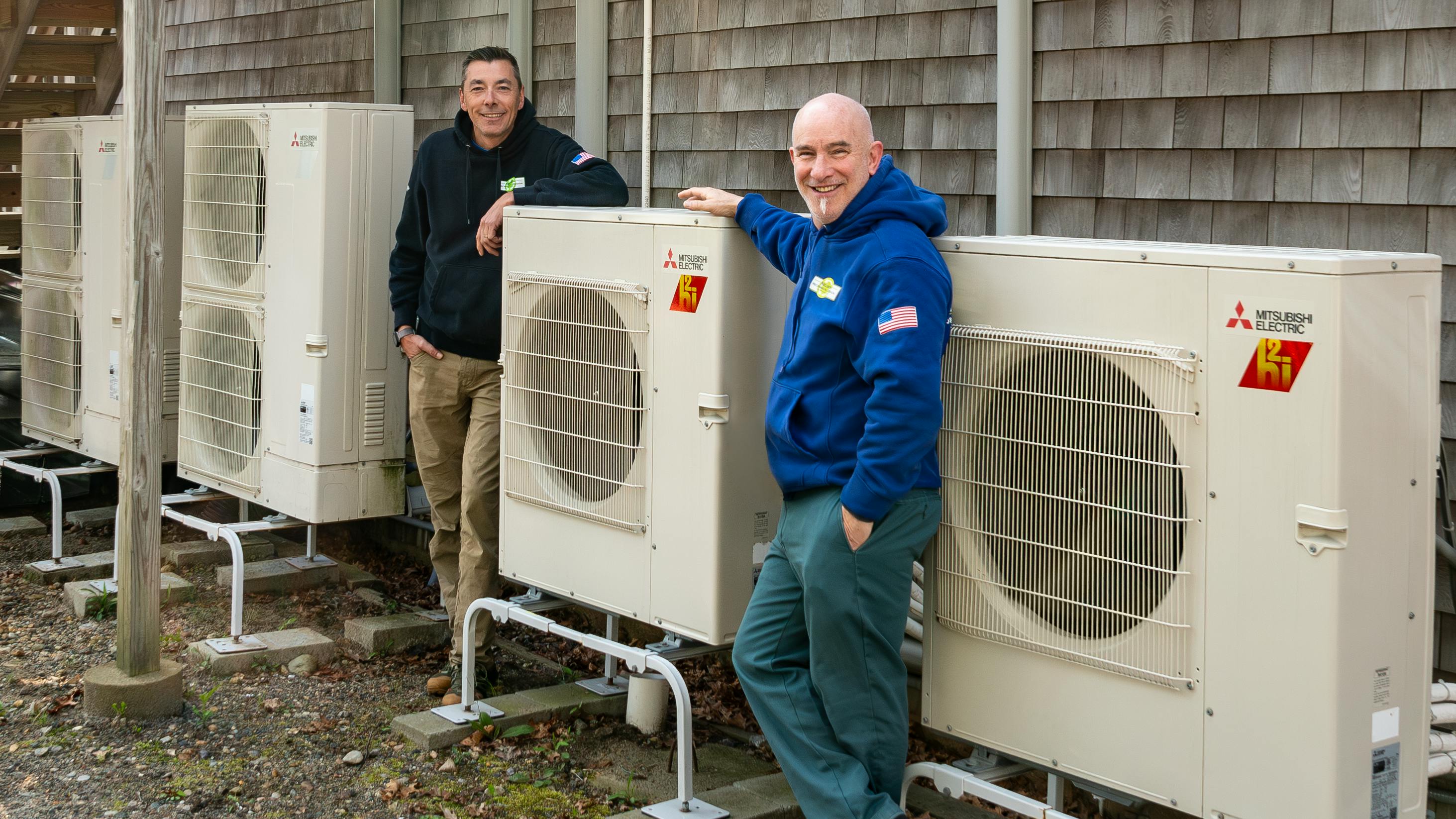 Dave Sprague and Brian Nelson with heat pumps.