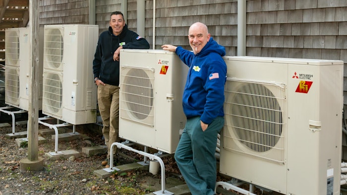 Dave Sprague and Brian Nelson with heat pumps.