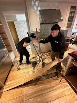 Technicians with John Rossi’s DRYmedic Restoration Services in California remove a customer’s kitchen floor after water damage. Technicians with John Rossi’s DRYmedic Restoration Services in California remove a customer’s kitchen floor after water damage.