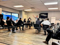 John Rossi (center, standing) during one of his weekly safety meetings for his California DRYmedic technicians. John Rossi (center, standing) during one of his weekly safety meetings for his California DRYmedic technicians.