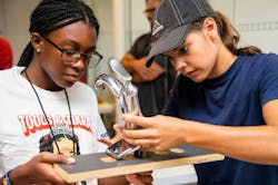 Tools & Tiaras Summer Campers, Paige (left) and Izzy (right), hard at work on a faucet install during a plumbing workshop. Tools & Tiaras Summer Campers, Paige (left) and Izzy (right), hard at work on a faucet install during a plumbing workshop.
