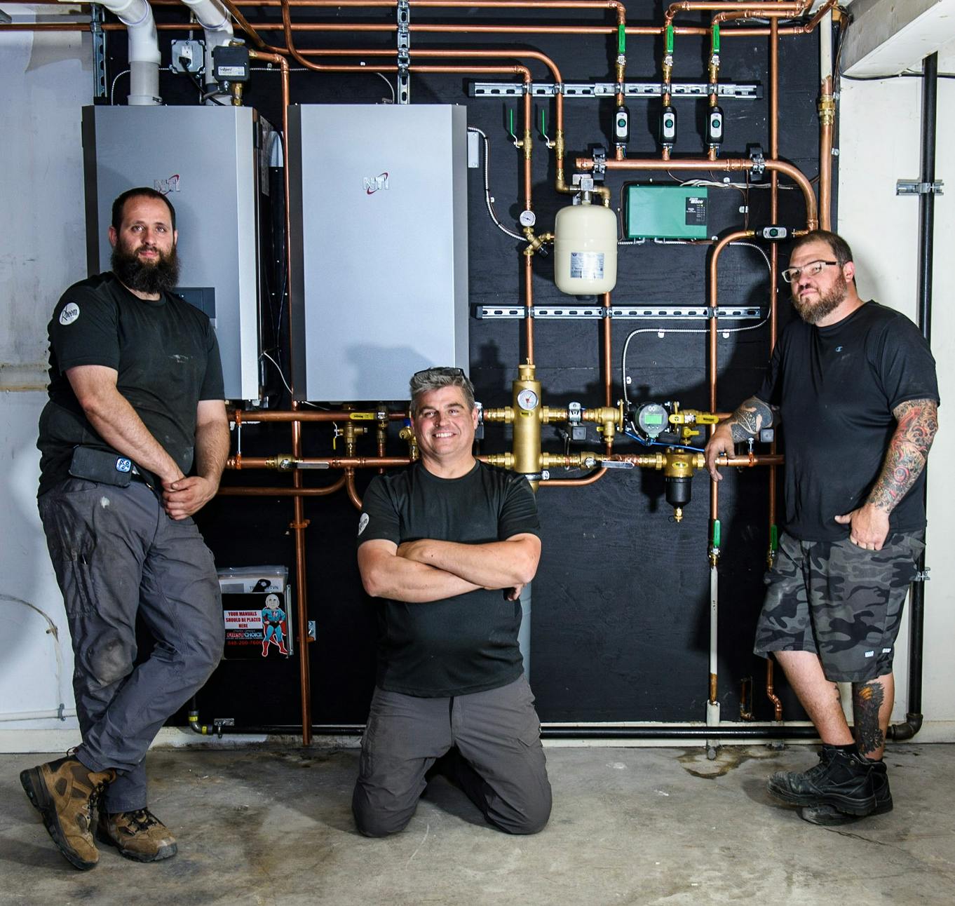 Mike Flynn, Ryan Adam and Tommie Boymann with the finished installation.