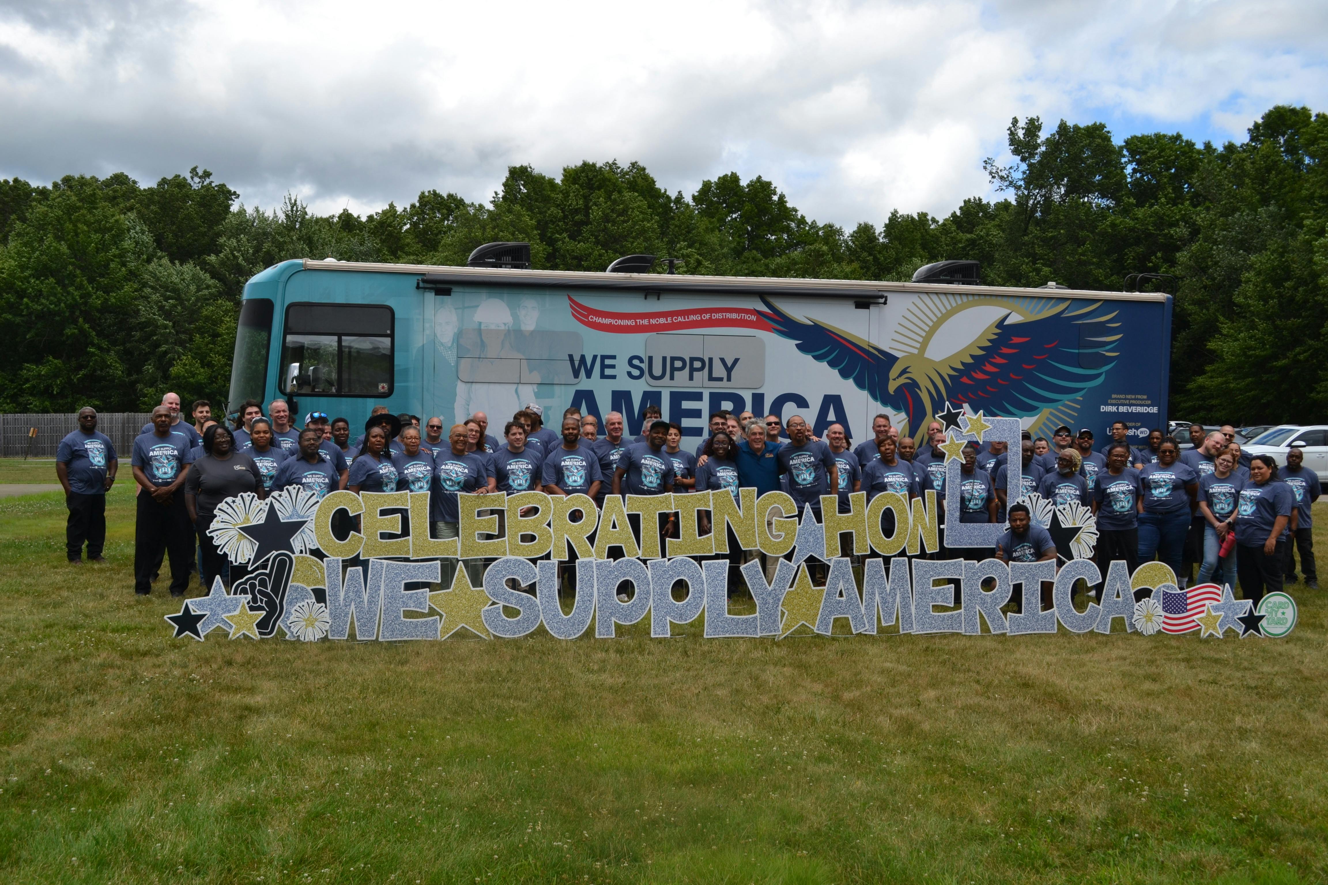 Merit Brass employees by the We Supply America RV.