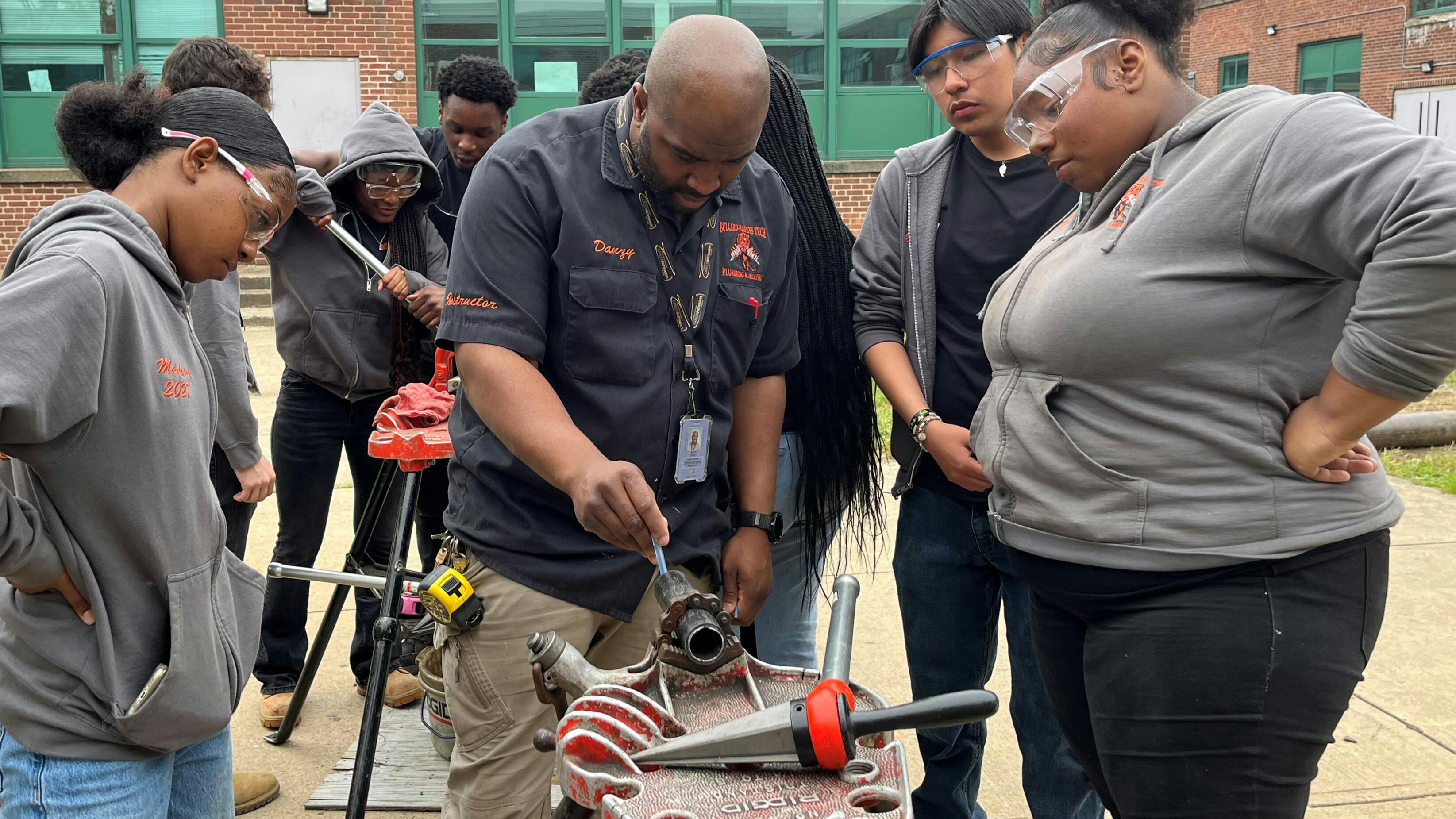 A Bradford White technical field trainer providse in-person plumbing training to Bullard-Havens students.