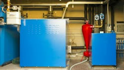 A geothermal heat pump in a mechanical room. A geothermal heat pump in a mechanical room.