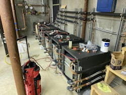 Making refrigerant connections to the new heat pump units. Making refrigerant connections to the new heat pump units.