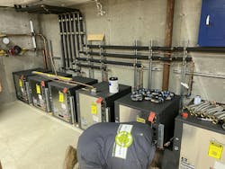 Making water connections to the new heat pump units. Making water connections to the new heat pump units.