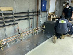 Sliding the new heat pumps into their bays. Sliding the new heat pumps into their bays.