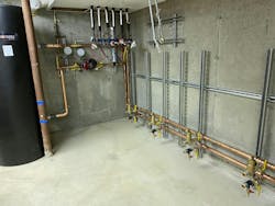 Buffer tank and inside heat pump loop pump in place. Buffer tank and inside heat pump loop pump in place.