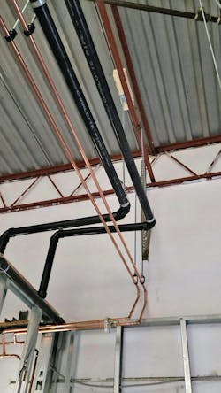 The discharge pipe runs 10 feet vertically and then 25 feet horizontally to the other end of the building. The discharge pipe runs 10 feet vertically and then 25 feet horizontally to the other end of the building.